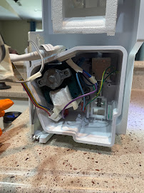 Interior of home appliance, mid-repair