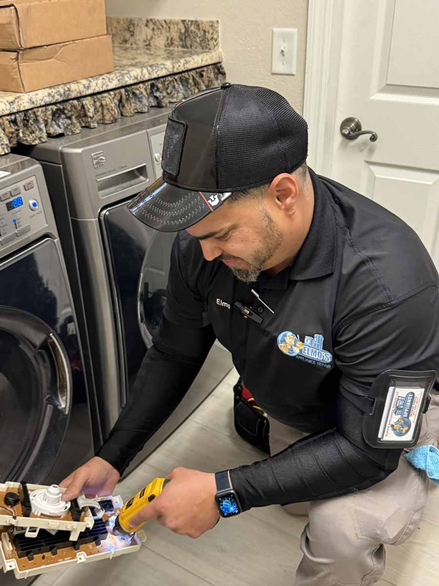 Elmo of Elmo's Appliance Repair repairing a Kenmore washing machine with power issues